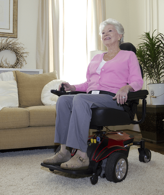 Elderly woman sitting in Pride Mobility Jazzy Select Power Wheelchair